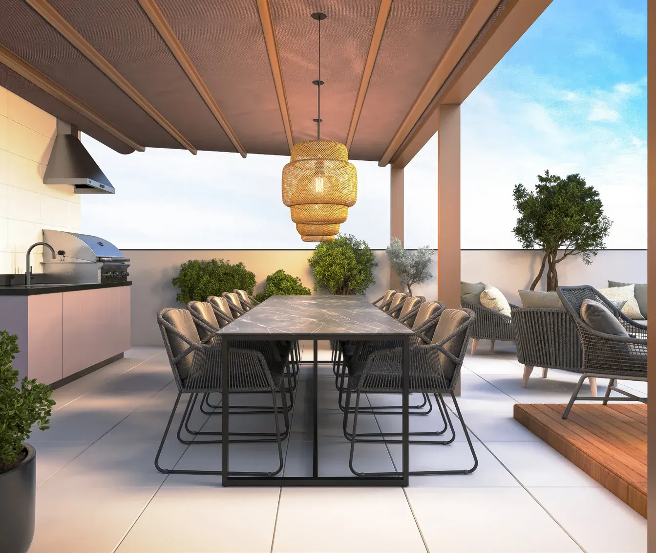Terraço da cobertura do Gríseo Residence com mesa para refeições e espaço de estar